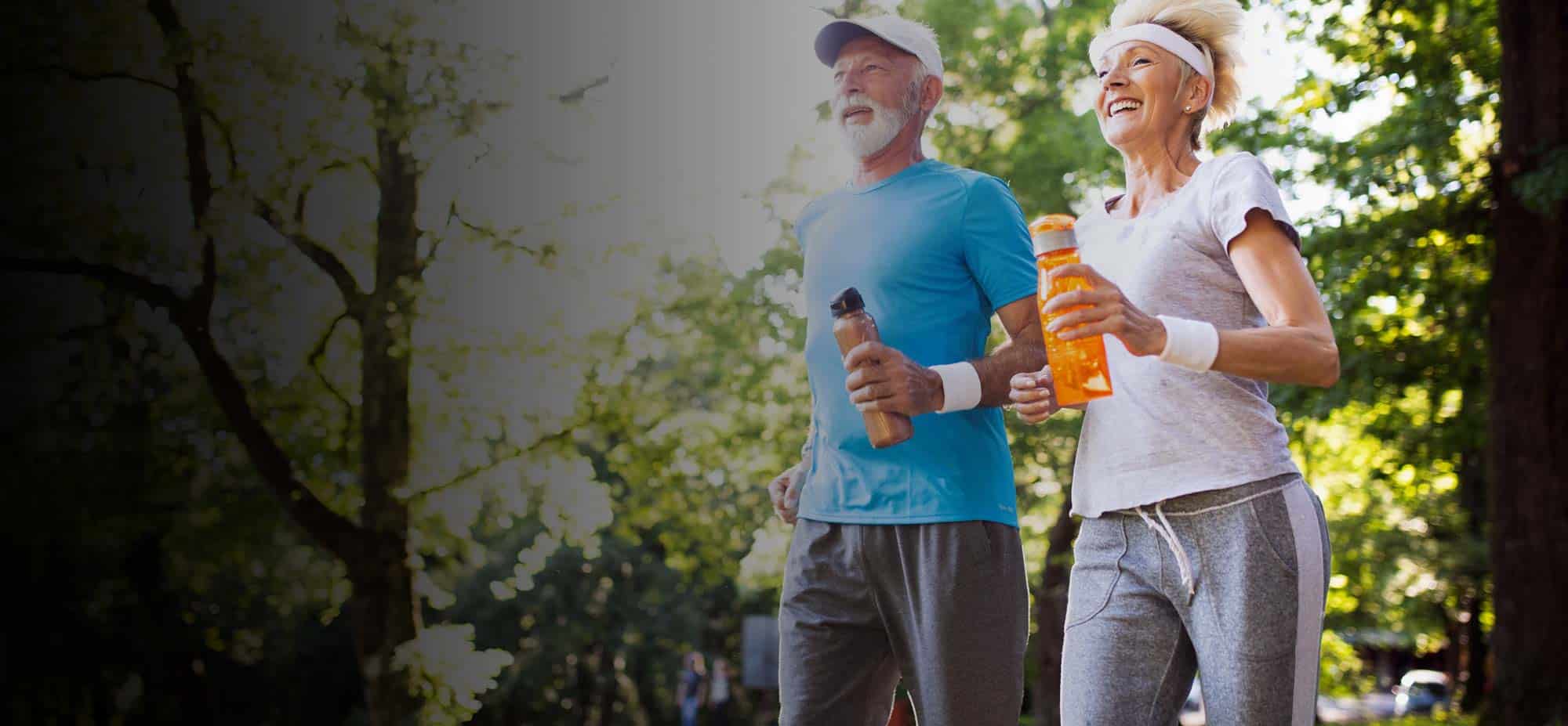 Active senior couple exercising outdoors